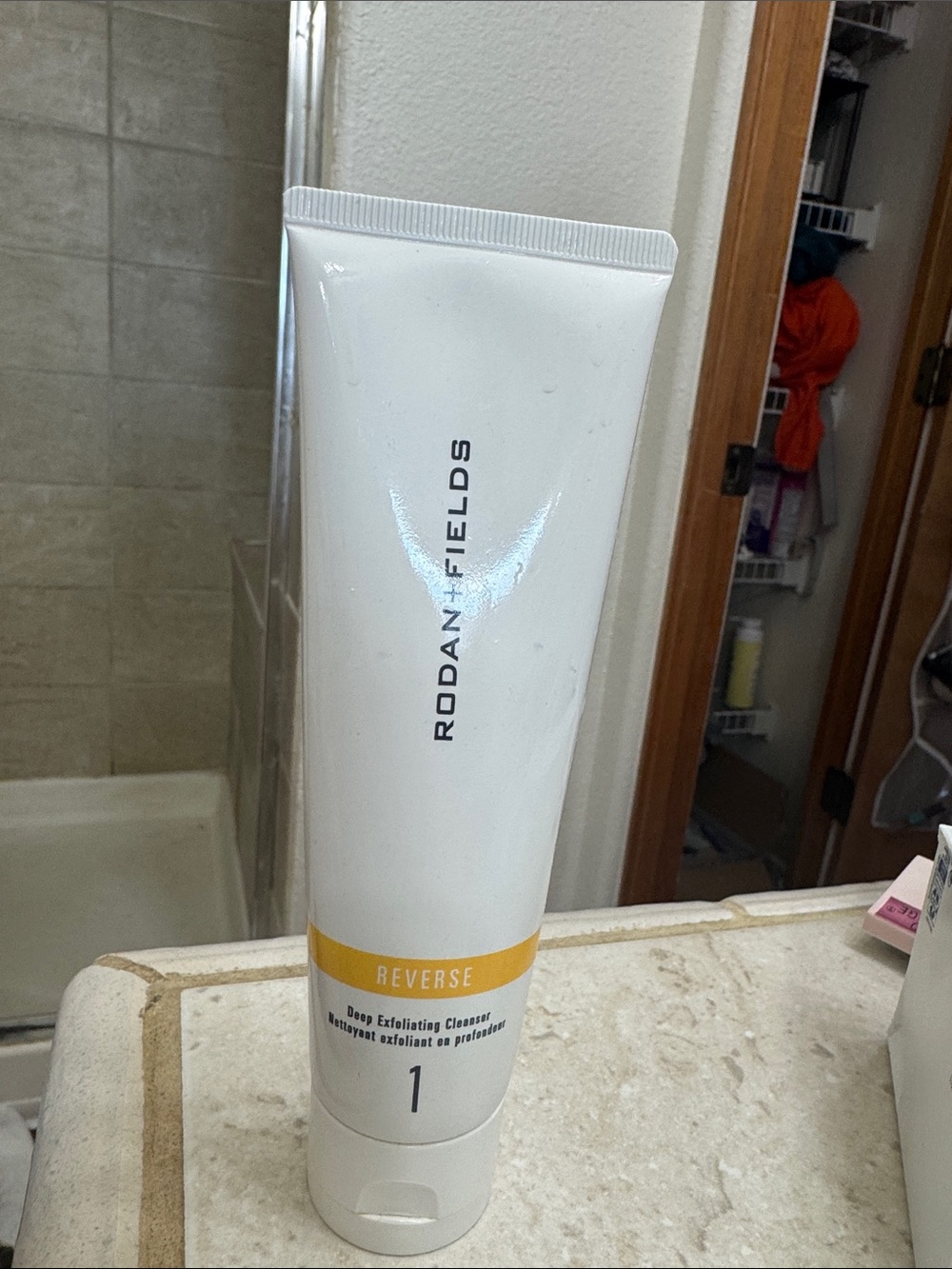 Rodan + Fields White Tube with Yellow Band